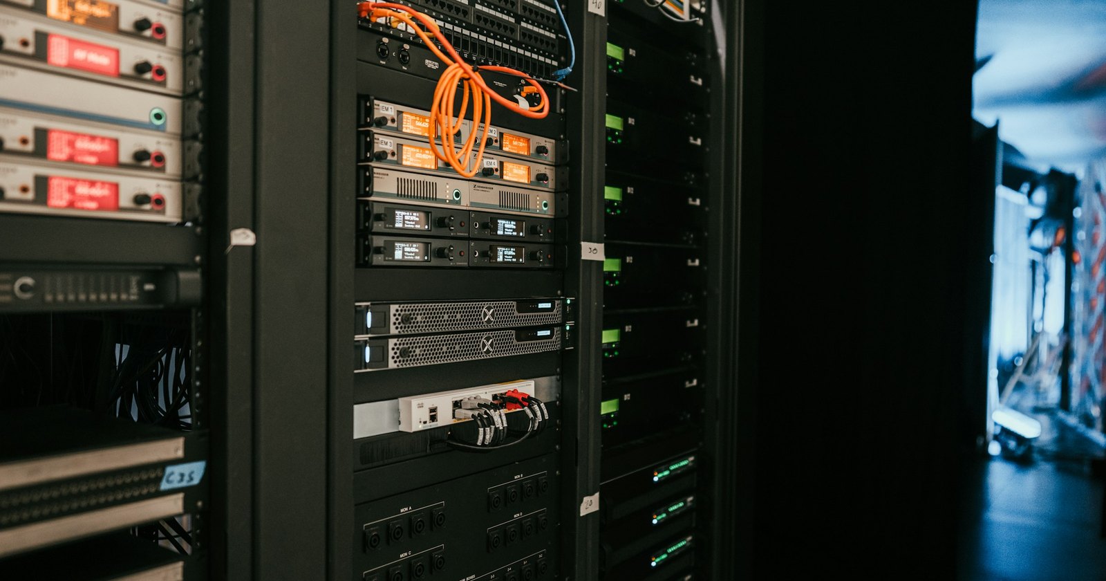 A rack of network servers and patch cables in a data centre