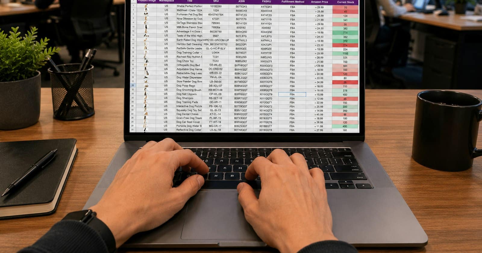 Hands at a laptop keyboard with a spreadsheet of figures on the screen
