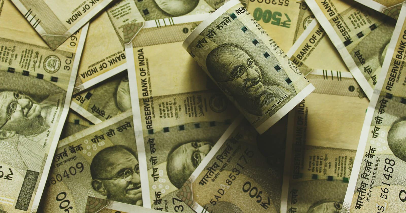 Indian five-hundred-rupee notes spread across a table