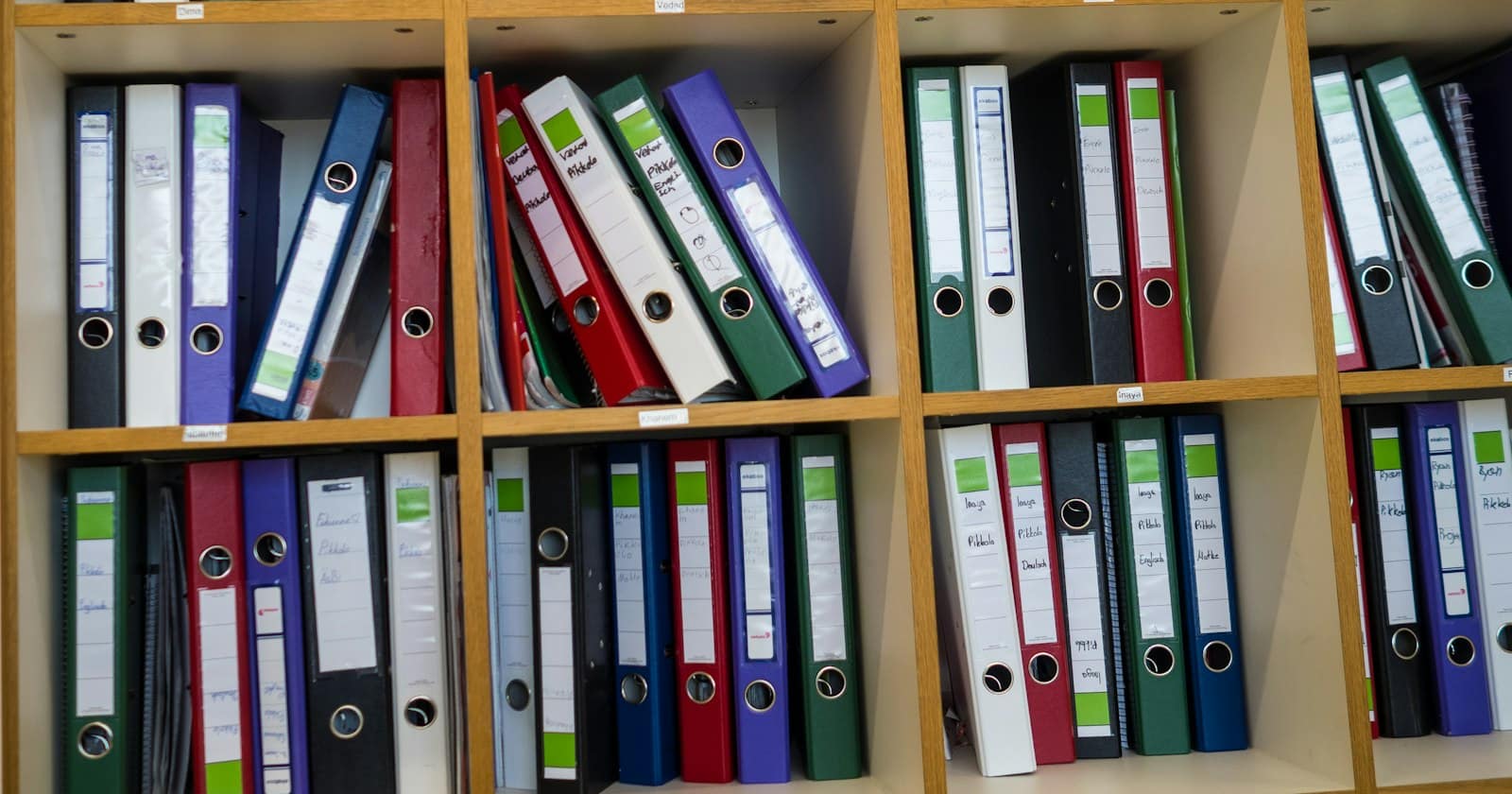 Shelves of client files in ring binders