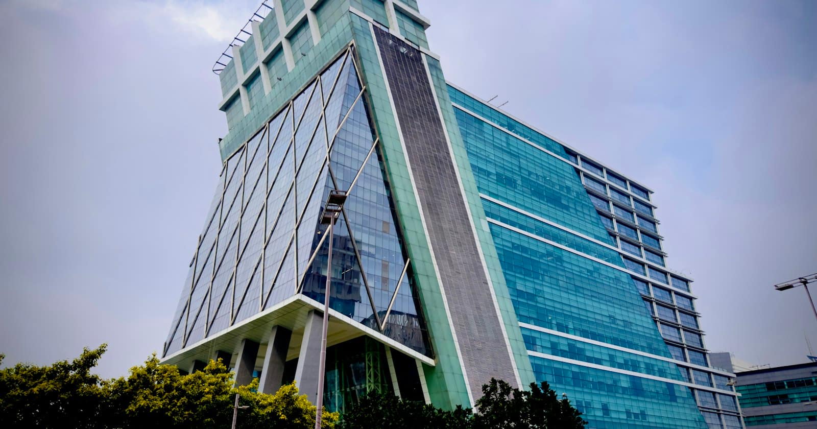 A glass-fronted corporate office tower
