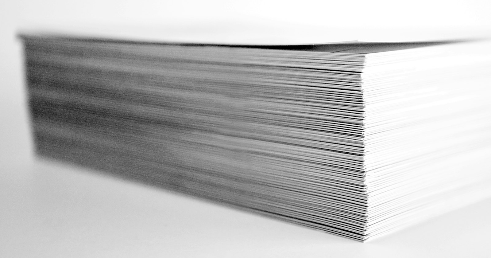 A thick stack of loose papers, its edges uneven