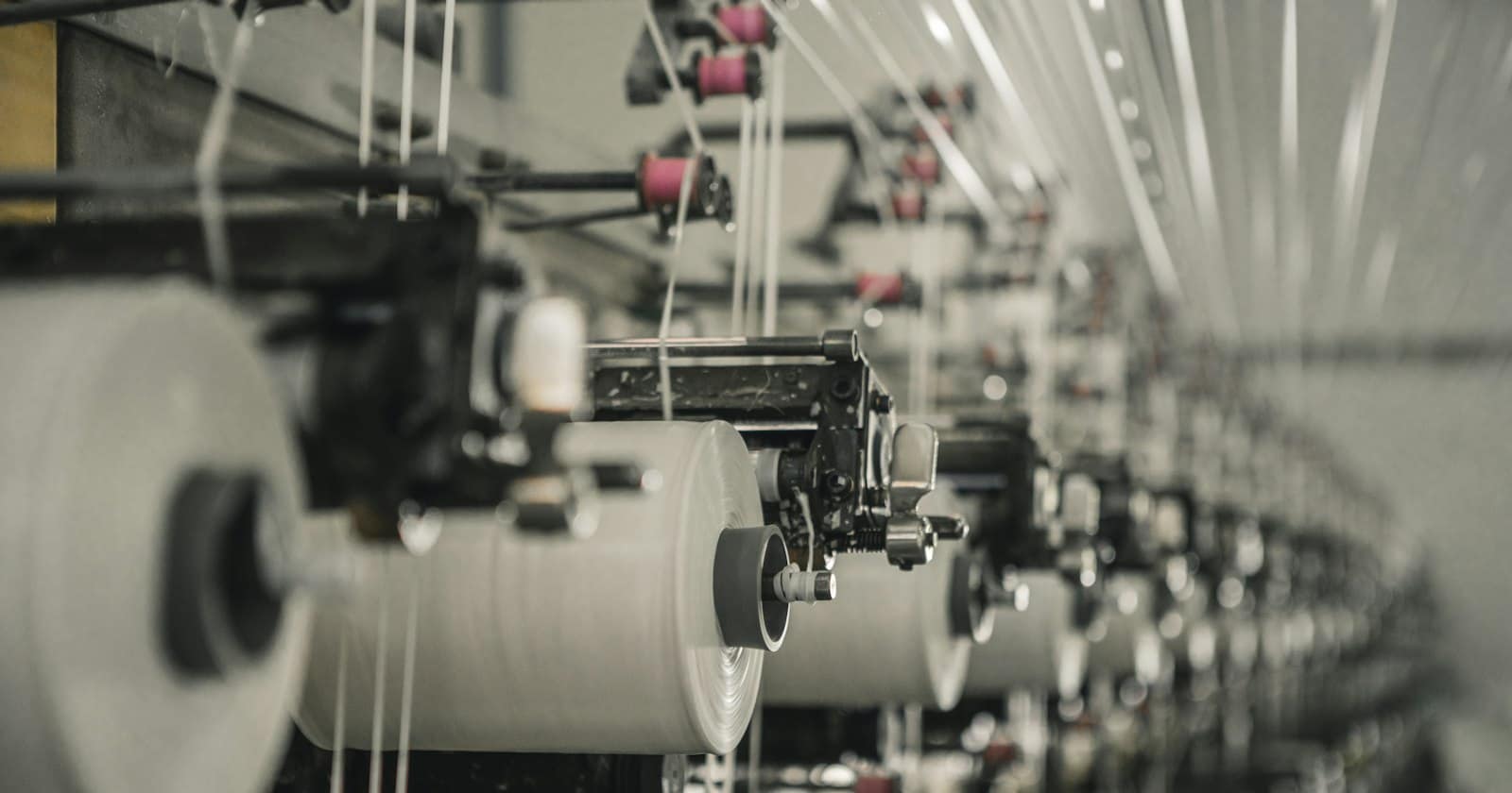 A row of machines on a textile mill floor