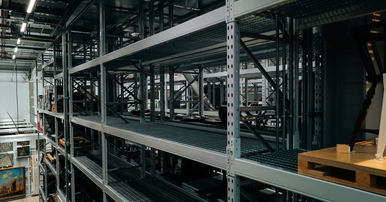 Industrial shelving in a warehouse, stacked with stored goods — the address that becomes a place of business